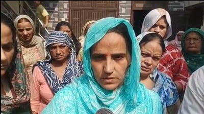 Sandeep Lathar’s wife, Santosh Devi, interacting with media in Julana on Friday. (HT)
