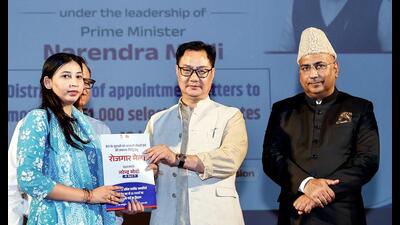 Union minister Kiren Rijiju presents a booklet during the Rozagar Mela Programme at Mata Vaishno Devi University in Katra on Friday. (ANI) Union minister Kiren Rijiju presents a booklet during the Rozagar Mela Programme at Mata Vaishno Devi University in Katra on Friday. (ANI)
