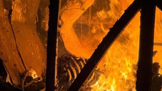Fire raging after a bus rammed into a motorcycle on National Highway 44 at around 3:30 am.(HT Photo/Sourced )