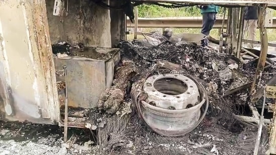 View of combusted bus after several people lose their lives as a bus burst into flames, near the Chinna Tekur village, in Kurnool on Friday.(ANI Video Grab)