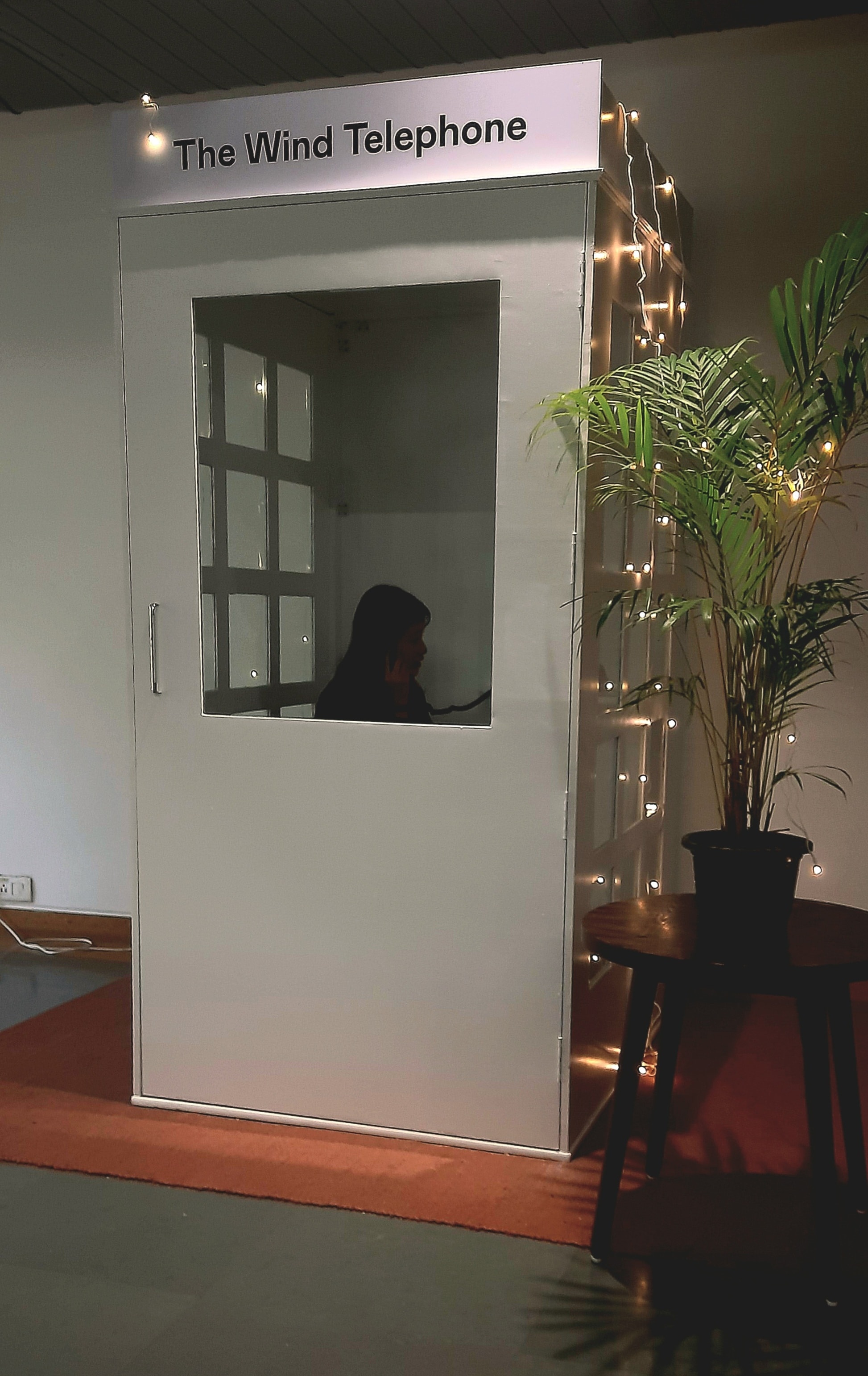 An installation called the Wind Telephone saw a long line people waiting outside a subtly lit phone booth to speak on an unconnected phone to a loved one they had lost. (Charumathi Supraja)