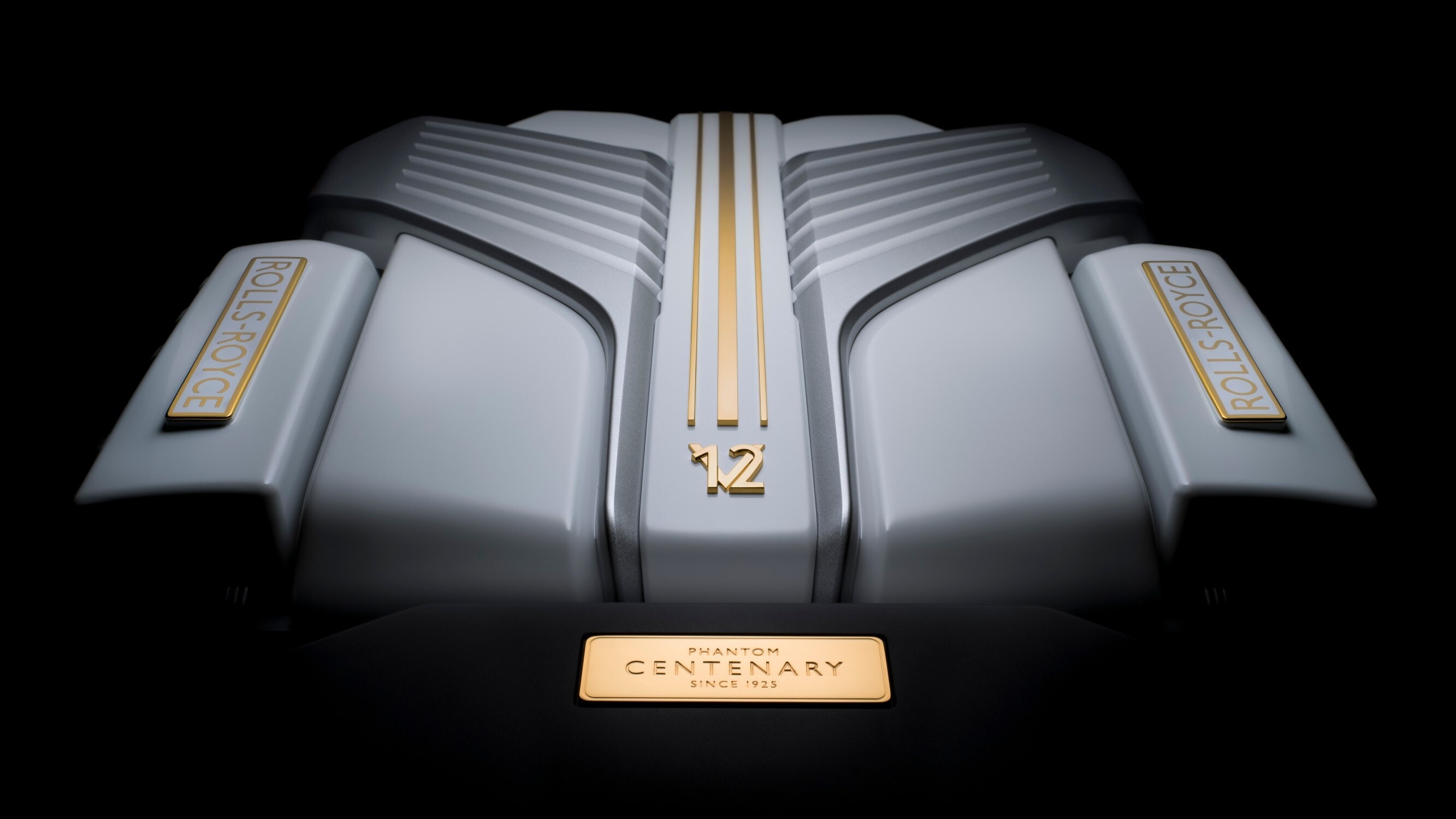 The Centenary features the 6.75-litre twin-turbo V12 engine from the Rolls-Royce Phantom VIII under an Arctic White cover with 24-carat gold accents The Centenary features the 6.75-litre twin-turbo V12 engine from the Rolls-Royce Phantom VIII under an Arctic White cover with 24-carat gold accents