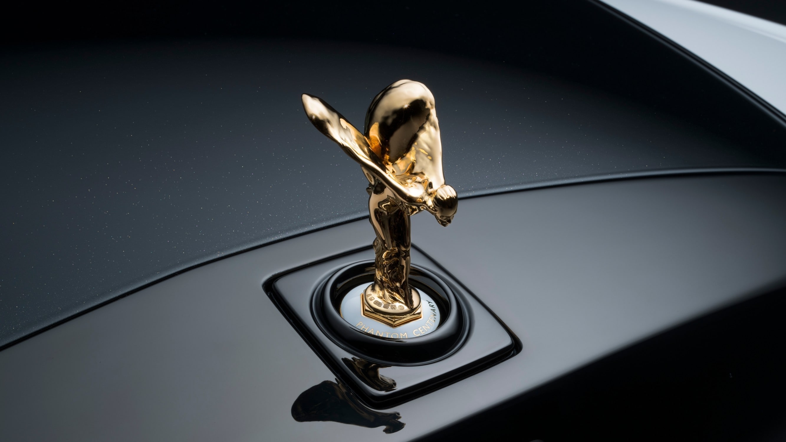 The Spirit of Ecstasy lies recast in 24-carat gold, bearing the hallmark to reference the Phantom Centenary The Spirit of Ecstasy lies recast in 24-carat gold, bearing the hallmark to reference the Phantom Centenary