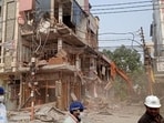 Bulldozers in action at the Central Market in Meerut on Saturday. (HT) Bulldozers in action at the Central Market in Meerut on Saturday. (HT)