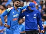 Shreyas Iyer reacts in pain after falling on the ground while taking a catch to dismiss Australia's Alex Carey- Shreyas Iyer reacts in pain after falling on the ground while taking a catch to dismiss Australia's Alex Carey-
