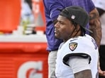 Lamar Jackson of the Baltimore Ravens sits on the sidelines against the Kansas City Chiefs at Arrowhead Stadium on September 28.