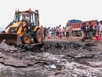 A view of the spot where a bus caught fire following a collision with a two-wheeler near the Chinnatekur village, in Kurnool on Friday. 
