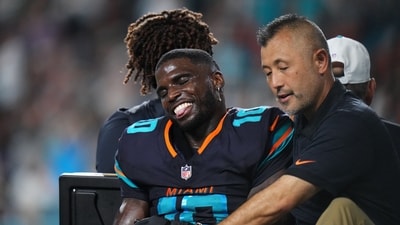 Miami Dolphins wide receiver Tyreek Hill (10) is tended to by medical staff after injuring his leg against the New York Jets. (IMAGN IMAGES via Reuters Connect)