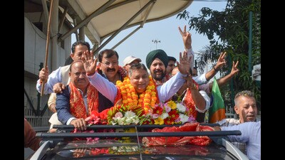 Jammu and Kashmir BJP President Sat Sharma arrives at the party office, a day after winning the Rajya Sabha election, in Jammu, on Saturday. (PTI) Jammu and Kashmir BJP President Sat Sharma arrives at the party office, a day after winning the Rajya Sabha election, in Jammu, on Saturday. (PTI)