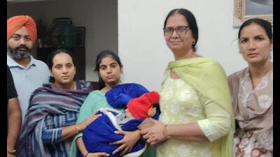 Officials of the Mansa child welfare wing of the state social welfare department with rescued child. (HT) Officials of the Mansa child welfare wing of the state social welfare department with rescued child. (HT)