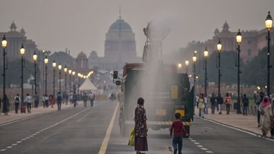 The anti-smog gun sprays water along the Kartavya path overlooking the Rashtrapati Bhavan, in New Delhi after the air quality was recorded poor. (PTI) The anti-smog gun sprays water along the Kartavya path overlooking the Rashtrapati Bhavan, in New Delhi after the air quality was recorded poor. (PTI)