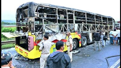 Police personnel investigate the spot after a bus caught fire following a collision with a two-wheeler near the Chinna Tekur village, in Kurnool on Friday. (ANI) Police personnel investigate the spot after a bus caught fire following a collision with a two-wheeler near the Chinna Tekur village, in Kurnool on Friday. (ANI)