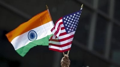A man holds the flags of India and the US flag in New York. (REUTERS) A man holds the flags of India and the US flag in New York. (REUTERS)