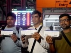 Passengers display their boarding passes at Netaji Subhas Chandra Bose International Airport before boarding the first direct flight to Guangzhou, China, after a five-year hiatus, as IndiGo resumes the route, in Kolkata, West Bengal.