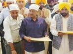 Punjab chief minister Bhagwant Mann and national convener of the Aam Aadmi Party (AAP) Arvind Kejriwal during the kirtan darbar at Gurdwara Rakab Ganj Sahib in New Delhi on Saturday. (PTI) Punjab chief minister Bhagwant Mann and national convener of the Aam Aadmi Party (AAP) Arvind Kejriwal during the kirtan darbar at Gurdwara Rakab Ganj Sahib in New Delhi on Saturday. (PTI)
