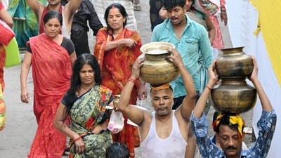Chhath devotees coming out after bathing in the Ganga River and carrying Ganga water on the occasion of the Chhath Puja festival at Gandhi Ghat in Patna, Bihar. (Santosh Kumar/ Hindustan Times)
