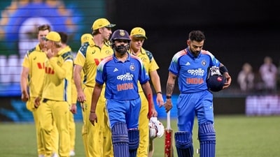 Rohit Sharma and Virat Kohli lead the teams off the field after a match-winning partnership. (PTI) Rohit Sharma and Virat Kohli lead the teams off the field after a match-winning partnership. (PTI)