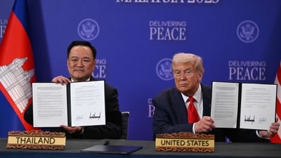 US President Donald Trump holds up a document with Thailand's Prime Minister during a ceremonial signing of a ceasefire agreement between Cambodia and Thailand. (AFP) US President Donald Trump holds up a document with Thailand's Prime Minister during a ceremonial signing of a ceasefire agreement between Cambodia and Thailand. (AFP)