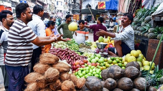 People purchase fruits for Chhath puja from a Market, in Prayagraj on Saturday.(Nitin Sharma/ANI)