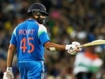 India's Rohit Sharma celebrates his century against Australia in the third ODI in Sydney, Australia, Saturday. (AP)
