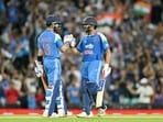 India's Rohit Sharma (R) and Virat Kohli celebrate their win in the third ODI against Australia. India's Rohit Sharma (R) and Virat Kohli celebrate their win in the third ODI against Australia.