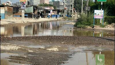 A waterlogged stretch with cratered road near Sectors 37 C-D in Gurugram (Parveen Kumar/HT)