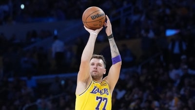 Los Angeles Lakers guard Luka Doncic shoots the ball against the Minnesota Timberwolves. (IMAGN IMAGES via Reuters Connect)