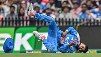 Shreyas Iyer falls on the ground after taking a catch to dismiss Alex Carey. (AFP) Shreyas Iyer falls on the ground after taking a catch to dismiss Alex Carey. (AFP)