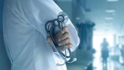 Doctor with stethoscope in hand on hospital background (REPRESENTATIVE PHOTO) Doctor with stethoscope in hand on hospital background (REPRESENTATIVE PHOTO)
