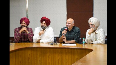 Former Delhi Education Minister Manish Sisodia interacts with students at Guru Nanak Dev University, in Amritsar. (PTI)