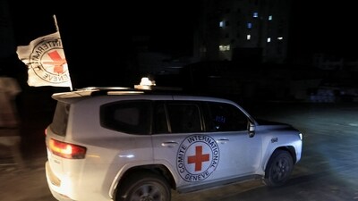 Red Cross transports the body of a deceased hostage, who had been held in Gaza since the deadly October 7, 2023, attack, after it was handed over by Hamas militants as part of a ceasefire and a hostages-prisoners swap deal between Hamas and Israel, in Gaza City, (REUTERS)