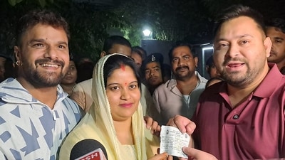 Patna: RJD leader Tejashwi Yadav, right, addresses the media after giving the party's membership slip to singer and actor Khesari Lal Yadav, right, and his wife Chanda, in Patna. (PTI/Representational) Patna: RJD leader Tejashwi Yadav, right, addresses the media after giving the party's membership slip to singer and actor Khesari Lal Yadav, right, and his wife Chanda, in Patna. (PTI/Representational)