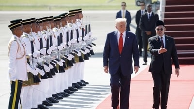 President Trump after his arrival in Malaysia with Prime Minister Anwar Ibrahim.