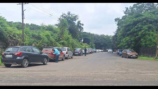 At a time when citizens are struggling to find authorised parking, car dealers are allegedly using public roads as rent-free showrooms for their used cars. (HT)