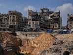 Palestinians watch as Egyptian machinery and workers search for the bodies of hostages in Hamad City, Khan Younis, in the southern Gaza Strip. Palestinians watch as Egyptian machinery and workers search for the bodies of hostages in Hamad City, Khan Younis, in the southern Gaza Strip.