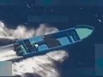 This combination of screen grabs images from a video posted by US Defense Secretary Pete Hegseth on his X account on October 22, 2025, shows what Hegseth says is US military forces conducting a strike on a vessel being operated by a "designated terrorist organization conducting narco-trafficking" in the Eastern Pacific Ocean on October 21, 2025. 