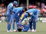 Shreyas Iyer (2R) is being checked by his teammates after he falls on the ground while taking a catch during the third ODI match vs Australia Shreyas Iyer (2R) is being checked by his teammates after he falls on the ground while taking a catch during the third ODI match vs Australia