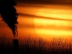 Emissions from a coal-fired power plant are silhouetted against the setting sun in Kansas City, Missouri, USA. (AP)