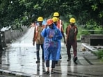 Metro site workers walk during rainfall ahead of Cyclone Montha in Chennai on October 27, 2025. Metro site workers walk during rainfall ahead of Cyclone Montha in Chennai on October 27, 2025.