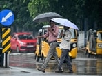 Pedestrians carry umbrellas as they walk along a street during rainfall ahead of Cyclone Montha. Pedestrians carry umbrellas as they walk along a street during rainfall ahead of Cyclone Montha.