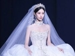 Huang Zitao, also known as Z Tao or Tao, is a Chinese rapper, singer, producer, and actor who was a former member of the K-pop group EXO. He married actor and singer Xu Yiyang on October 16, 2025, in a grand ceremony held in China. The wedding was a spectacular affair, featuring multiple outfit changes. Here's a look at Xu Yi Yang's 10 gowns from her showstopping wedding. (All pics Reddit/ popculturechat and Instagram/ mayadstudios)