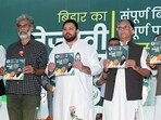 Rashtriya Janata Dal leader Tejashwi Yadav, with CPI-ML General Secretary Dipankar Bhattacharya, VIP chief Mukesh Sahni, and Congress leader Pawan Khera, a joint press conference of Mahagathbandhan during the Bihar Assembly elections, in Patna on Tuesday. Mahagathbandhan release their manifesto. 