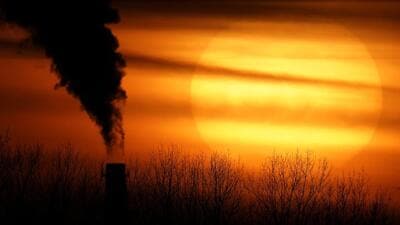 Emissions from a coal-fired power plant are silhouetted against the setting sun in Kansas City, Missouri, USA. (AP) Emissions from a coal-fired power plant are silhouetted against the setting sun in Kansas City, Missouri, USA. (AP)