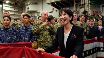 Takaichi listens to Trump speak to members of the military aboard the USS George Washington, an aircraft carrier docked at an American naval base, in Yokosuka, Tuesday, Oct. 28, 2025. (AP Photo/Mark Schiefelbein) (AP) Takaichi listens to Trump speak to members of the military aboard the USS George Washington, an aircraft carrier docked at an American naval base, in Yokosuka, Tuesday, Oct. 28, 2025. (AP Photo/Mark Schiefelbein) (AP)