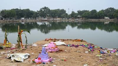 Litter and leftover puja materials seen near Basai pond after Chhath Puja celebrations. (Parveen Kumar/HT) Litter and leftover puja materials seen near Basai pond after Chhath Puja celebrations. (Parveen Kumar/HT)