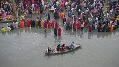 New Delhi: People perform rituals in the Yamuna river on the last day of the Chhath Puja celebrations. (PTI) New Delhi: People perform rituals in the Yamuna river on the last day of the Chhath Puja celebrations. (PTI)