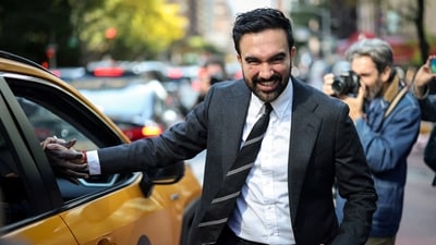 Democratic candidate for New York City Mayor, Zohran Mamdani, shakes the hand of a cab driver while campaigning in Manhattan's Upper East Side neighborhood during early voting, in New York City, on October 27, 2025. (Mike Segar/Reuters)