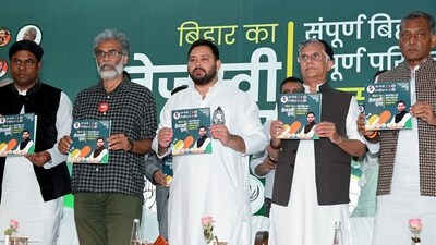 Rashtriya Janata Dal leader Tejashwi Yadav, with CPI-ML General Secretary Dipankar Bhattacharya, VIP chief Mukesh Sahni, and Congress leader Pawan Khera, a joint press conference of Mahagathbandhan during the Bihar Assembly elections, in Patna on Tuesday. Mahagathbandhan release their manifesto. (ANI) Rashtriya Janata Dal leader Tejashwi Yadav, with CPI-ML General Secretary Dipankar Bhattacharya, VIP chief Mukesh Sahni, and Congress leader Pawan Khera, a joint press conference of Mahagathbandhan during the Bihar Assembly elections, in Patna on Tuesday. Mahagathbandhan release their manifesto. (ANI)