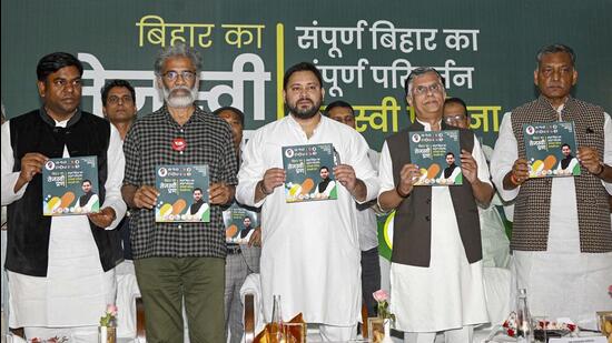 RJD leader Tejashwi Yadav along with Congress leaders Pawan Khera and Akhilesh Prasad Singh, CPI-ML (Liberation) general secretary Dipankar Bhattacharya and Vikassheel Insaan Party chief Mukesh Sahni releases the Mahagathbandhan’s manifesto for the Bihar Assembly election, in Patna, on Tuesday. (PTI)