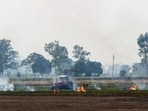 Farmer burns paddy stubble in a village, in Patiala on Wednesday (ANI)